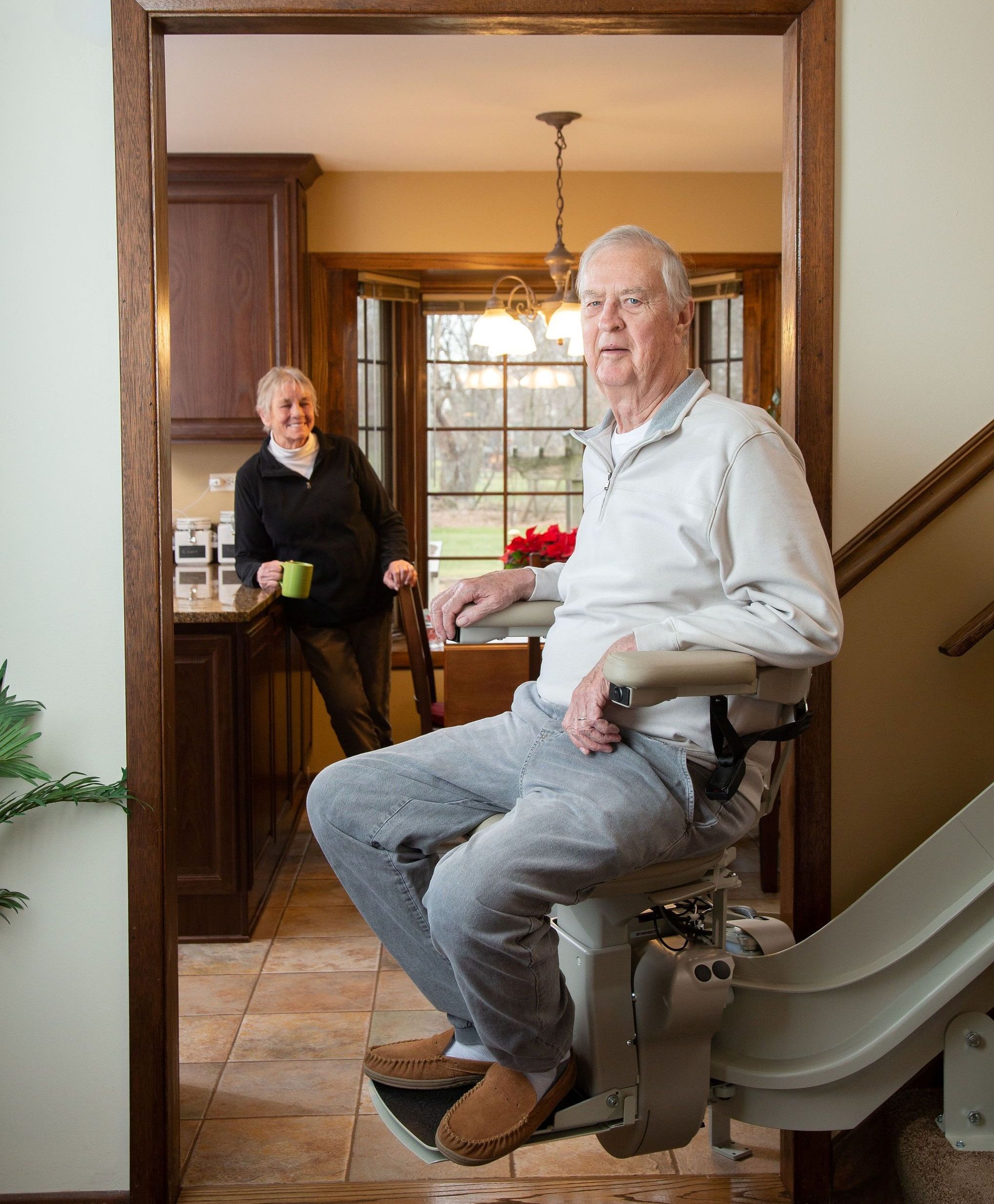 Lifeway Mobility customer riding his new stairlift in his home